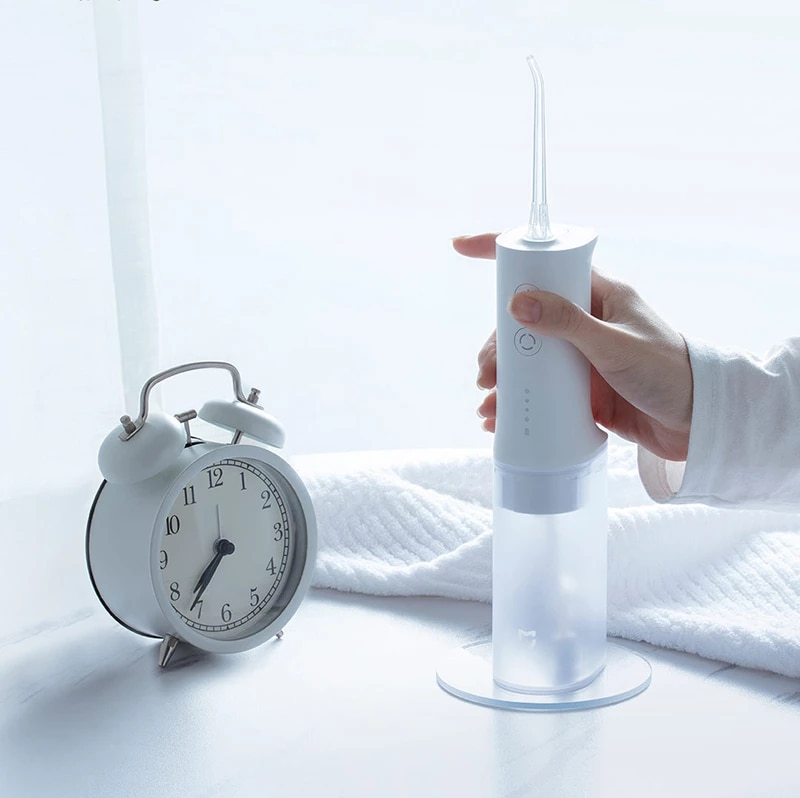 Xiaomi, portable dental oral irrigator, USB cable, electric toothbrush, dental hygiene, batteries, electricity, travel, work, in-office cleaning, home, office, side effects, dry mouth, tooth decay, tooth cleaning.